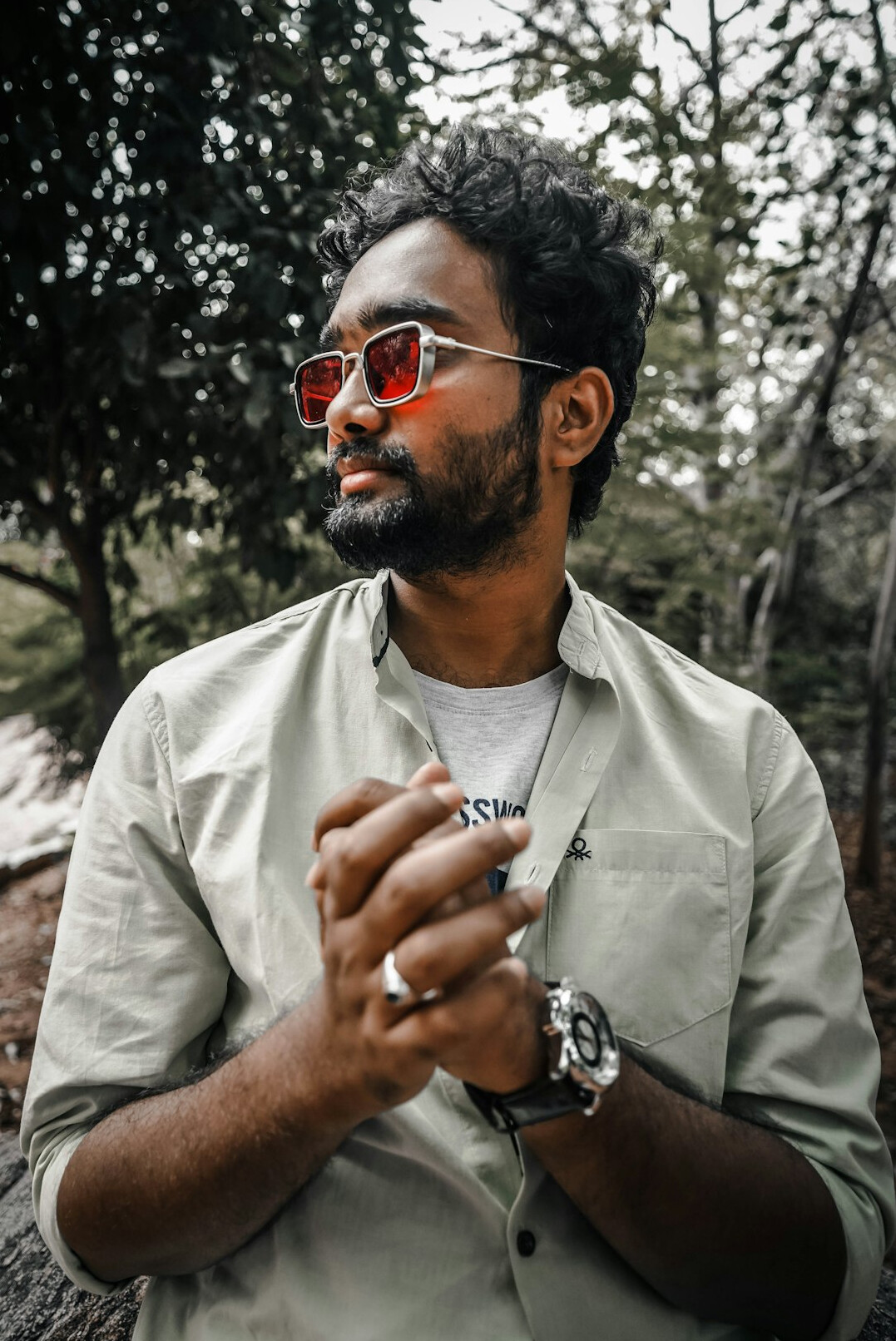 Portrait of a bearded man with glasses in a casual shirt
